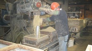 Sand Casting - A picture of a man making a sand casting at Quaker City Castings.